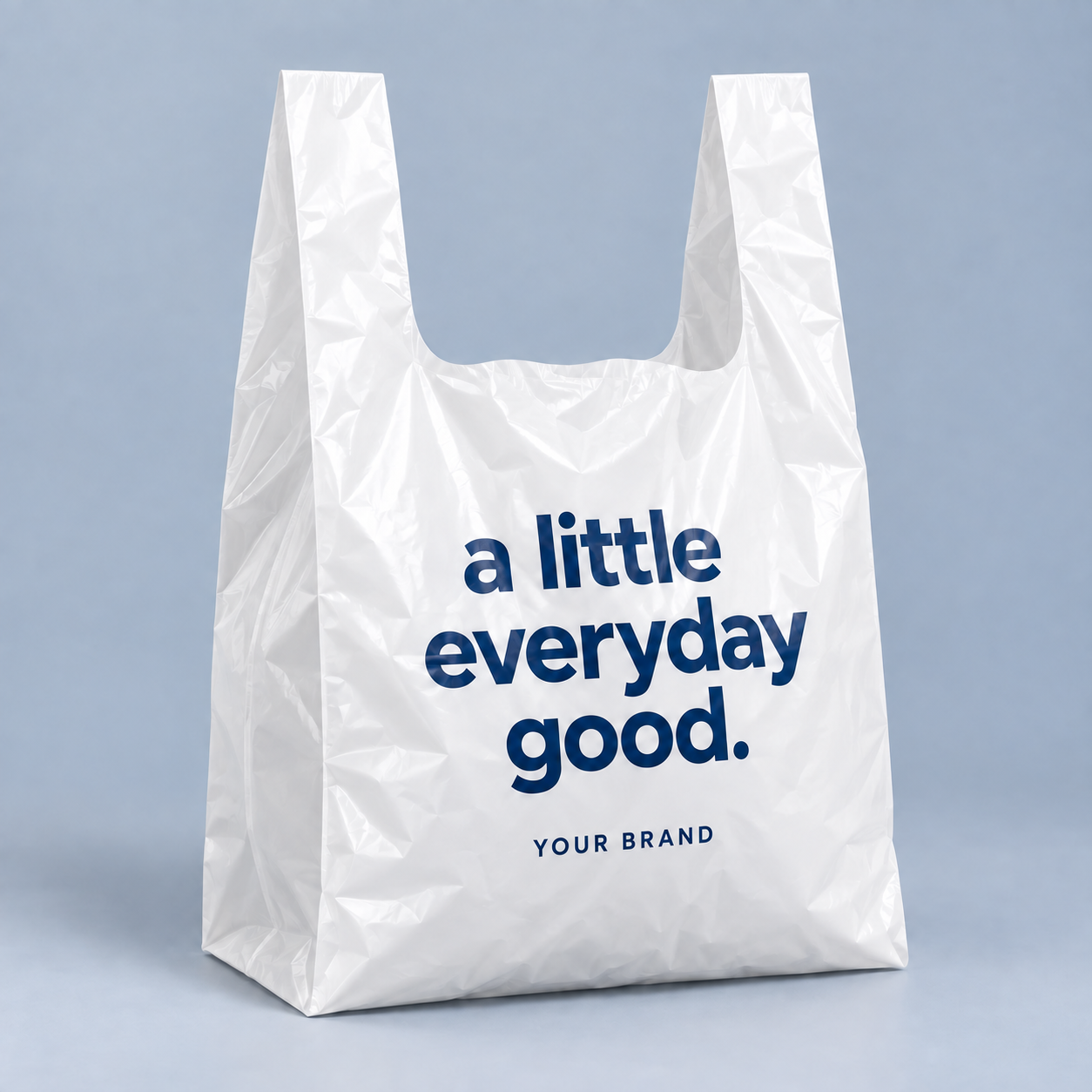White T-shirt plastic bag with integral handles and a deep U-shaped opening